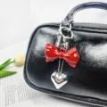 Elegant red acrylic bow with metallic silver heart pendant bag charm for handbags - Horizontal Bow Pendant (02) / Red