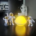 Astronaut figurine planet night light set, creative moon lamp desk decor for bedroom gift. - Gold-Trimmed Astronaut 3-Piece Set & Planet Lamp (Battery Operated)