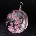 Handmade forest-style round glass pendant with pink dried flowers embedded in resin - Silver Wire (P2026)