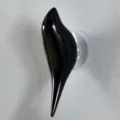 Modern minimalist glossy black bird-shaped decorative wall hook with suction cup attachment - Black