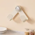 Wall-mounted rotating pot lid holder, punch-free kitchen organizer rack in cream white. - Cream