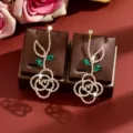 Sparkling rhinestone flower earrings with green crystal leaves, elegant high-end fashion jewelry. - Gold