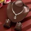Detailed view of sparkly rhinestone necklace and drop earrings set for women, elegant bridal jewelry. - Two-Piece Set / Green