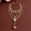 Detailed close-up of a glamorous gold rhinestone slave bracelet featuring delicate linked chains. - HB990 / Gold
