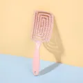 Pink curved hair brush for smooth detangling and voluminous styling, lightweight vented design. - Peach Pink