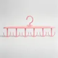 Pink rotating multi-hook bra and underwear hanger for home wardrobe closet storage and organization. - Pink
