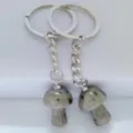Natural crystal mushroom keychain pendant detail shot, polished stone charms for bags. - 1