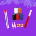 36-piece hand sewing needle set with storage tube, thread spools, threaders, and thimbles. - 36-Piece Set