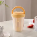 Portable fruit salad cup with fork, yellow portable food container for office and outdoor use. - Yellow & White