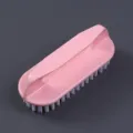 Durable pink plastic laundry brush with soft white bristles and ergonomic handle grip - Flat Brushes / Pink