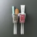 Wall-mounted toothbrush holder set with two cups, punch-free bathroom organizer for home. - Two-Slot Automatic Toothpaste Dispenser
