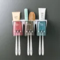 Wall-mounted toothbrush holder set with 3 cups and drain inverted design for bathroom. - Three-Slot Automatic Toothpaste Dispenser