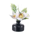 Black ceramic bottle reed diffuser with white orchid flowers and green leaves for home decor. - White Flower - Gardenia