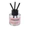 Glass reed diffuser bottle with black sticks and pink label for home fragrance and decor. - Pink - Aromatherapy (Scent: White Peach Oolong)