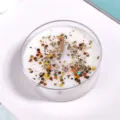 Handcrafted scented soy wax candle in clear container with decorative glitter flakes. - Yellow Sequins [Orange Blossom] / Approx. 30g