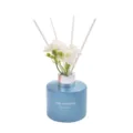 Blue glass reed diffuser with white sticks and flowers, home fragrance oil bottle decor. - French Quarter / 120ML