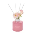 Pink glass reed diffuser bottle with artificial flowers and sticks for home fragrance decor. - Cherry Blossom / 120ML