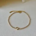 Elegantes vergoldetes Tennisarmband mit einem funkelnden Zirkonia-Stein in schöner Herzform. - Transparenter Herzstil