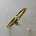 Bracelet jonc élégant en acier inoxydable doré avec une pierre en zircon en forme de cœur - Bracelet Jonc Zirconia Cœur / Or