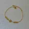 Eleganter 18K vergoldeter Edelstahl Gänseblümchen Armband mit glänzenden Perlen für Damen - Gänseblümchen Armband / Gold