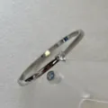 Bracelet jonc en acier inoxydable argenté avec un zircon brillant en forme de cœur. - Bracelet Jonc Zirconia Cœur / Argent