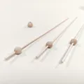 Natural wood diffuser sticks and beads set, perfect accessory for essential oil diffusion. - Through Round Wooden Bead with Rattan