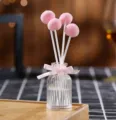 Flameless aromatherapy glass bottle with cute pink fluff balls and ribbon decor for room scent - Spring Lily