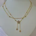 Elegant double-layered gold stainless steel daisy necklace with teardrop crystal charms - Double Layer Flower Tassel Necklace