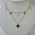 Elegant 18K gold plated double layer necklace with chic black and white clover charms. - Double Layer Black White Clover Necklace