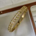 Luxury 18k gold plated stainless steel hollow bangle with sparkling crystal accents - Chain Row Stones Style / Gold