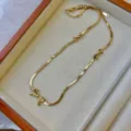Elegant minimalist gold-plated bow necklace featuring a sophisticated flat snake chain - 2mm Flat Snake Chain Bow Necklace / Gold