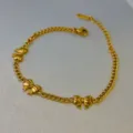Elegant minimalist gold-toned link chain necklace with three charming bow pendants. - Triple Bow Bracelet / Gold