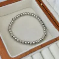 Elegantes poliertes Silberperlen-Stretcharmband in einer luxuriösen Geschenkbox aus Holz - Silbernes Perlen Elastisches Armband / 5mm
