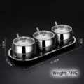 Premium 3-piece stainless steel seasoning jar set with glass lids, spoons, and serving tray - Set of 3 / 3 Pieces/Pack (With Spoons And Base)