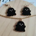 Close-up detail of black enamel cartoon ghost pendant necklace and matching earrings - Pendant Only (Without Chain) / Black 2