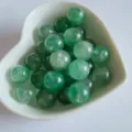 Natural green crystal agate round beads 12mm loose gemstone DIY jewelry detail view. - Green Strawberry Quartz
