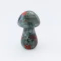 Natural crystal gemstone mushroom carving detail view, unique green red patterned stone art. - Bloodstone