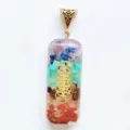 Detail shot of the 7 chakra crystal chips embedded in clear resin rectangular pendant with sacred geometry. - 5 Pieces Without Cord
