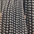 Hebras de cuentas de perlas de concha redondas gris oscuro para joyería DIY y accesorios. - Gris oscuro