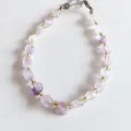 Natural irregular crystal chip bracelet detail view showing purple and clear quartz beads with gold - Light Amethyst