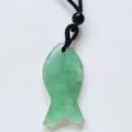 Green aventurine crystal fish pendant necklace detailed shot, charming lucky fish charm accessory - Green Strawberry Quartz