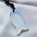Natural crystal fish pendant necklace detail view, elegant translucent gemstone design. - Opal (Synthetic)
