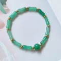 Close-up detail of green aventurine bamboo-shaped beaded bracelet with gold spacers - Bamboo Aventurine