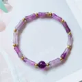 Detailed close-up view of a natural amethyst bamboo joint bracelet with golden beads - Bamboo Amethyst