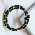 Double-layered black bamboo segment bracelet with gold and silver spacer beads. - Bamboo Obsidian
