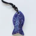 Natural purple crystal fish pendant necklace featuring a durable black braided cord. - Sodalite