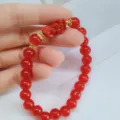Bracelet de perles rouges avec pendentif bête sculptée, bijou de style traditionnel chinois. - Rouge