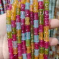 Gros plan de perles barils en bambou colorées style bonbon pour fabrication de bijoux DIY. - Grandes perles bambou 8*12,5 mm (env. 31 pcs)