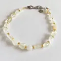 Natural irregular crystal chip beaded bracelet with shiny gold tone metal accents for women - Citrine