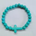 Natural turquoise beaded bracelet with a cross charm for women's holiday fashion - Cross